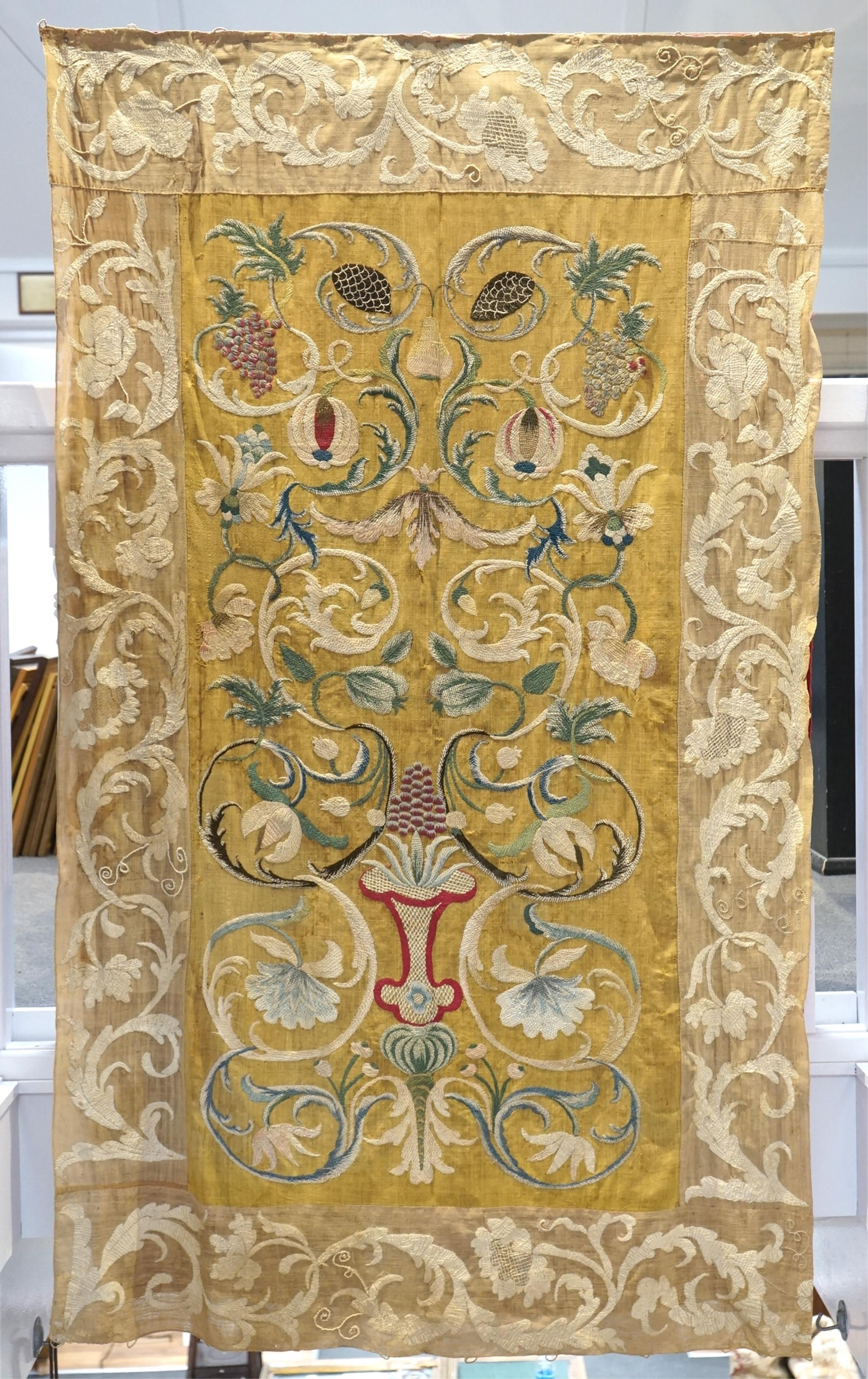 A large pair and one smaller panel of late 18th century Italian silk floss hand embroidered panels, possibly from Florence or Venice, both known for floss embroidery. Thought to be originally sacristy hangings. Elaborate